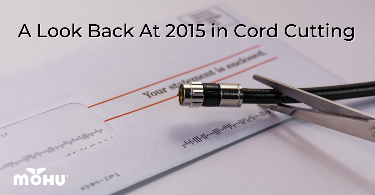 Cable bill sitting on a table, coax cable being cut by scissors, A Look Back At 2015 in Cord Cutting, mohu logo